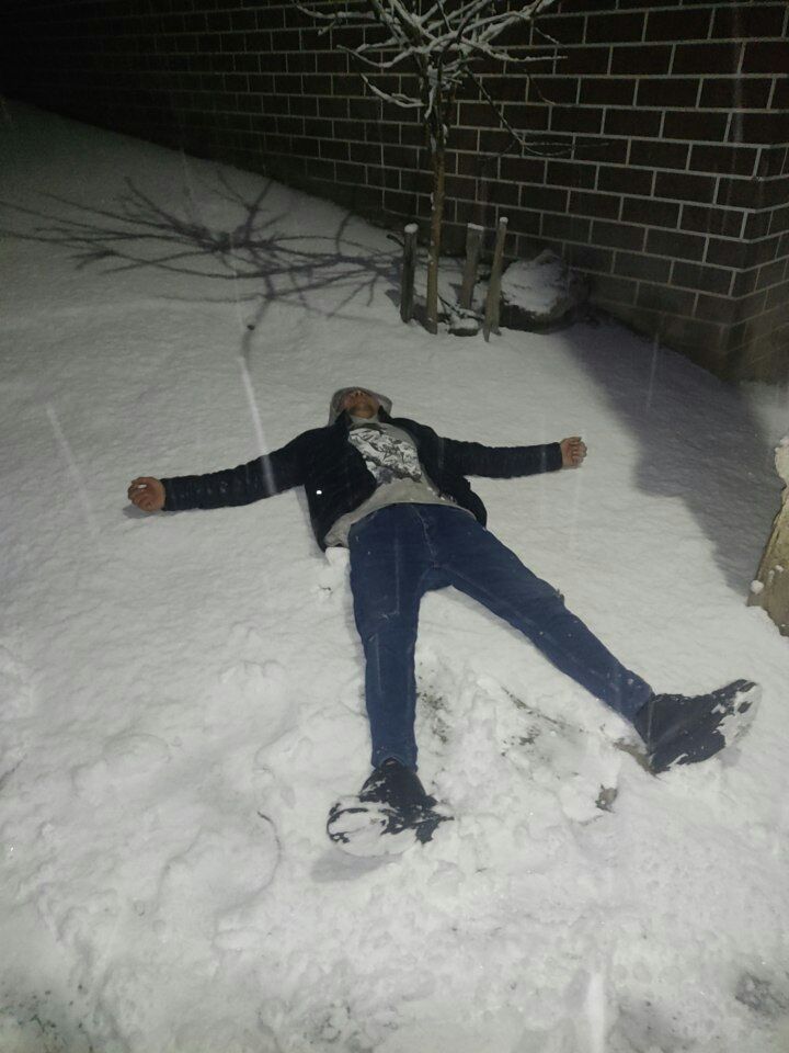 a person lying in the snow